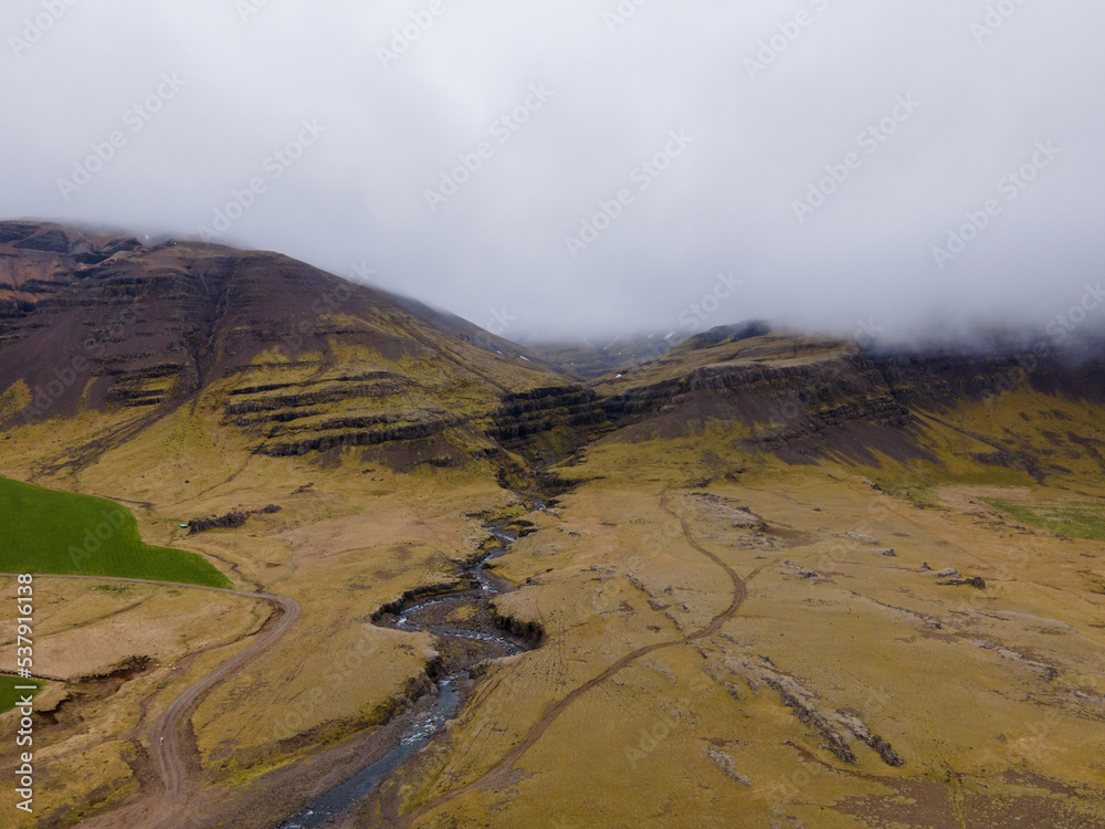 Aerial shot, Nice landscape of mountains and rivers with mossy field in iceland