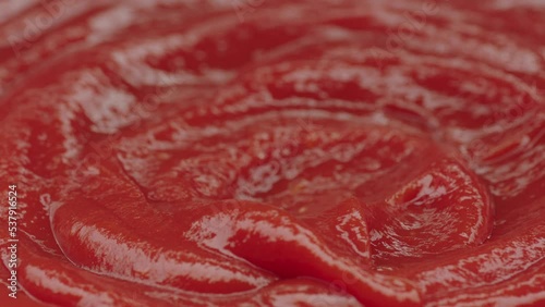 passing chicken nuggets in ketchup in slow motion