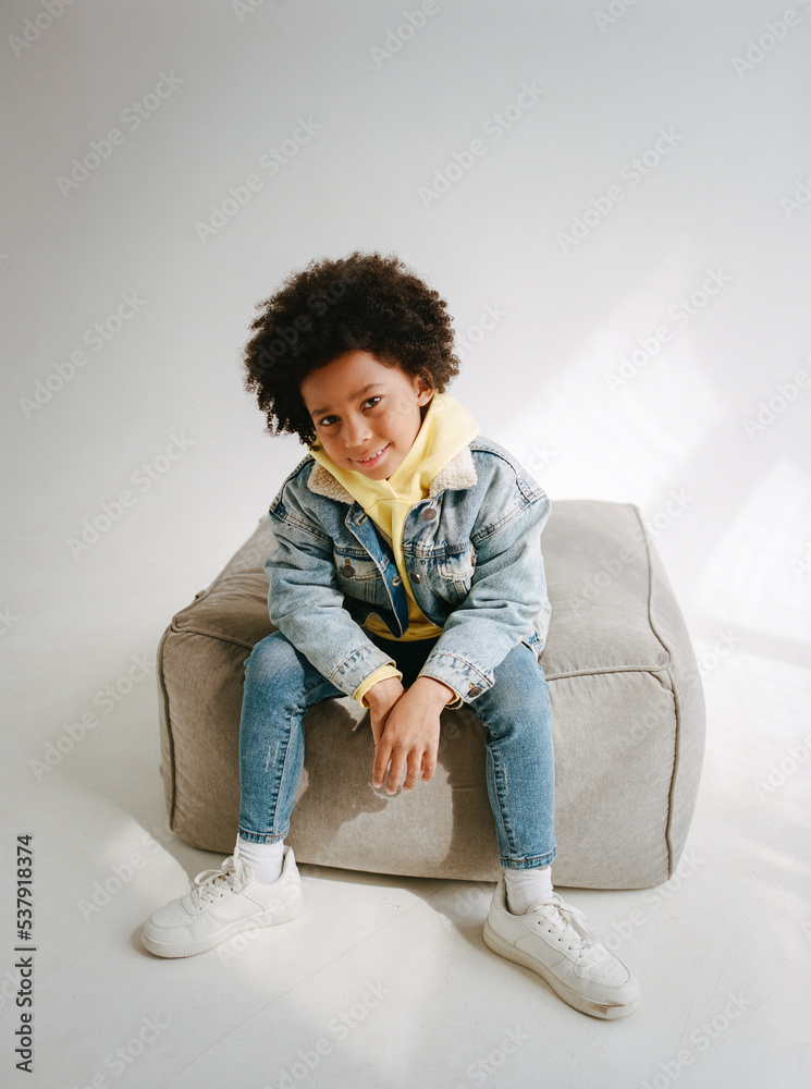 Young black kid posing in the studio