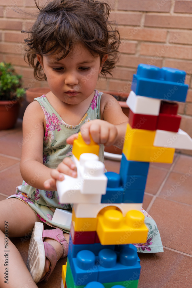 Little girl playing building block Little girl playing building block