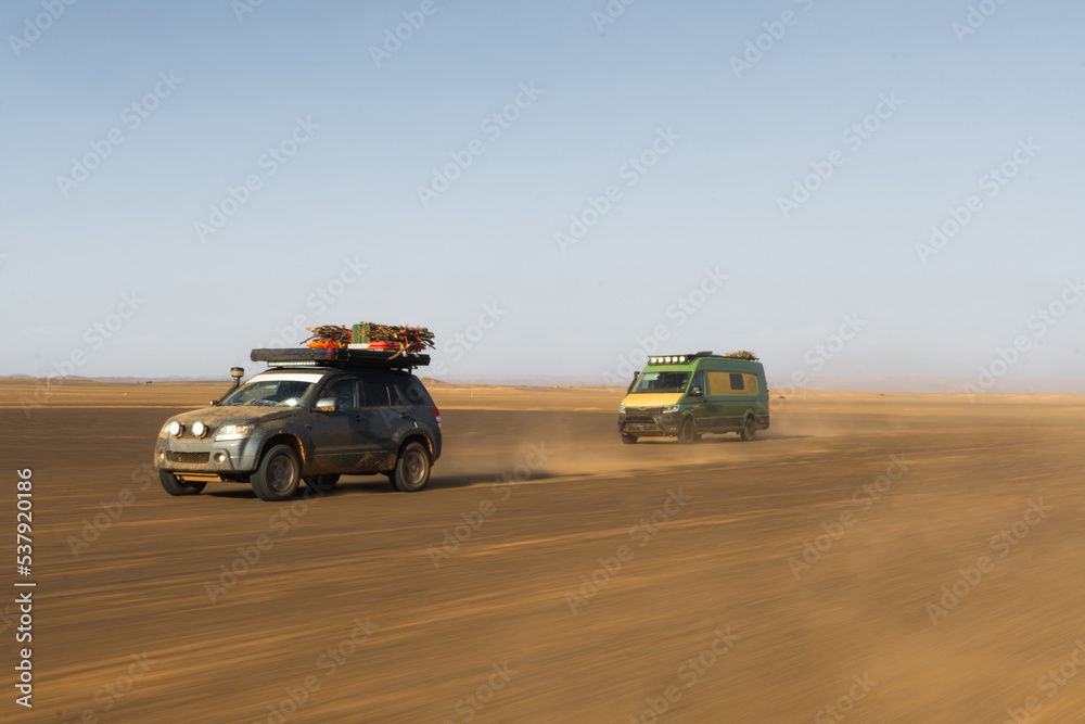 Cars racing in the desert Cars racing in the desert