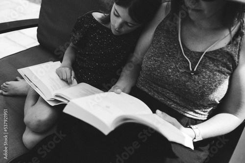 Black and White photos of daughter snuggling up against her mother