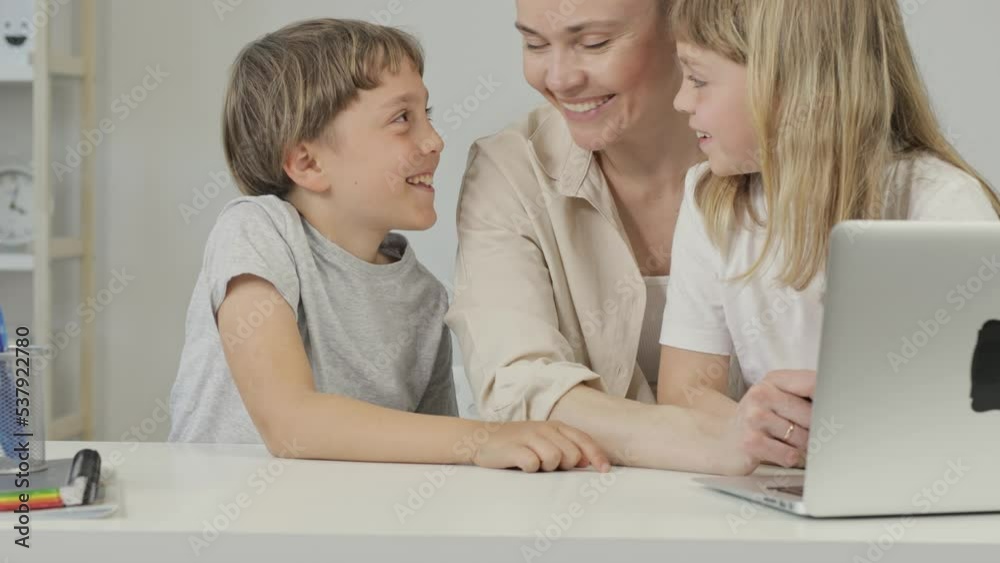 Mother and two children are discussing something. Mother and two children are discussing something.