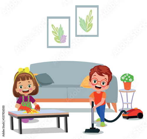 cute boy sweeping house with vacuum cleaner