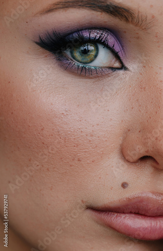 Closeup beauty portrait of eye with awesone make up photo