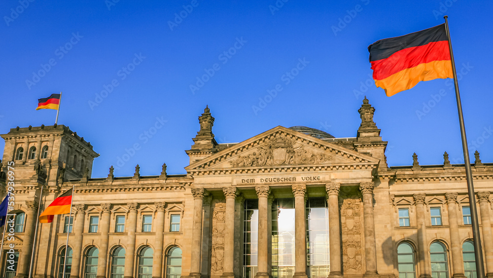 Obraz premium Reichstag building, seat of the German Parliament with national flag, Berlin