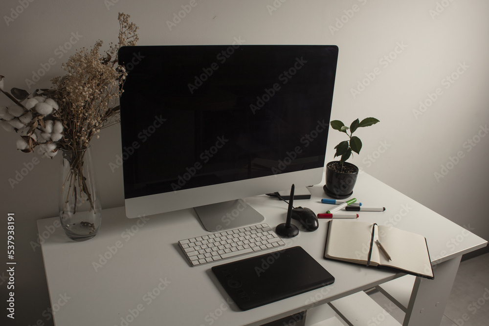 Interior design with PC desktop computer mockup and office supplies on the table. Comfortable place of work. Close-up top view of comfortable working place in office with and laptop. Work at home. Interior design with PC desktop computer mockup and office supplies on the table. Comfortable place of work. Close-up top view of comfortable working place in office with and laptop. Work at home.