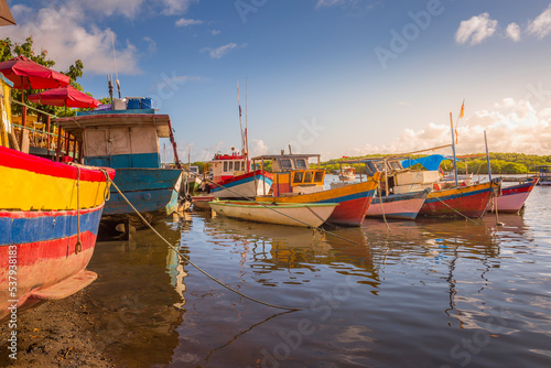 Bay at sunset with fishing trawler rustic boats in Porto Seguro, BAHIA, Brazil