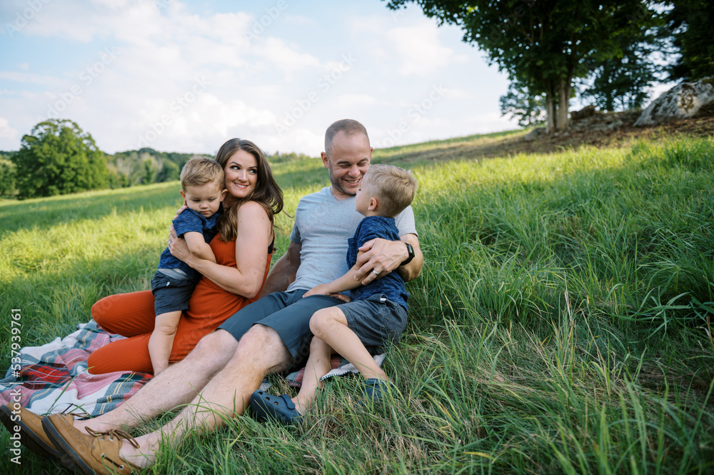 Happy family outdoors together in summer Happy family outdoors together in summer
