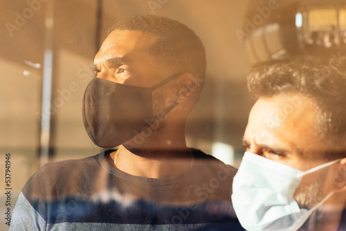 Men with face mask in home during the COVID-19 pandemic photo