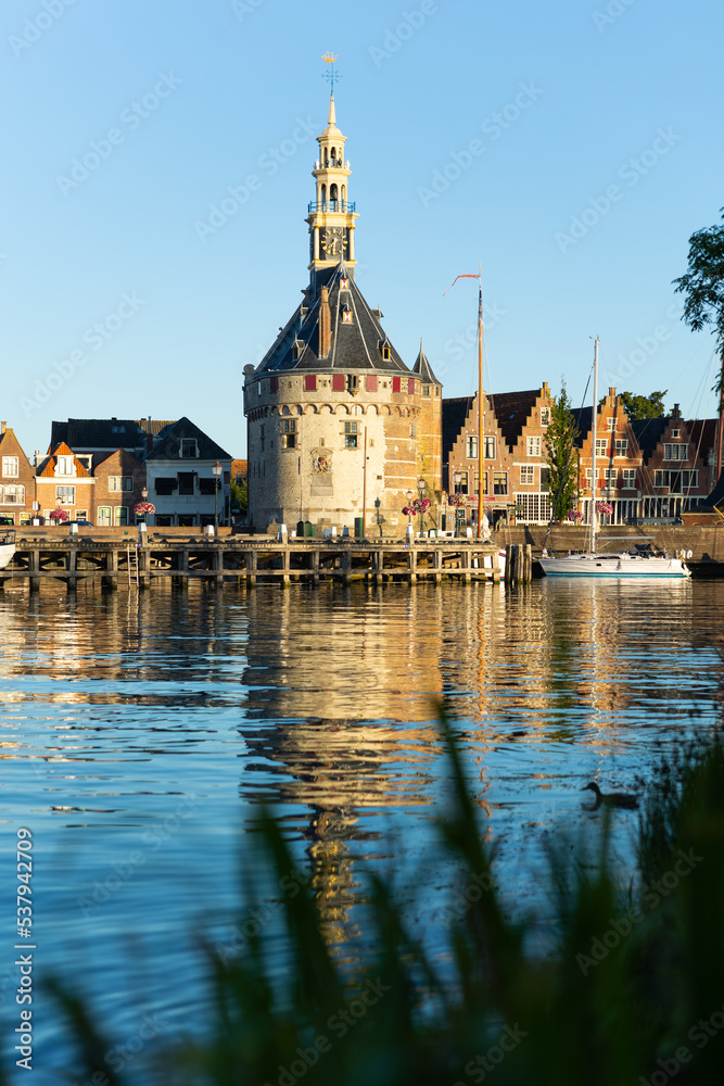 Clock tower Hoofdtoren on shore of Markermeer lake in province of North Holland, Netherlands.