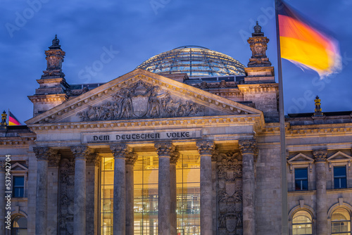 Reichstag building, seat of the German Parliament with national flag, Berlin photo