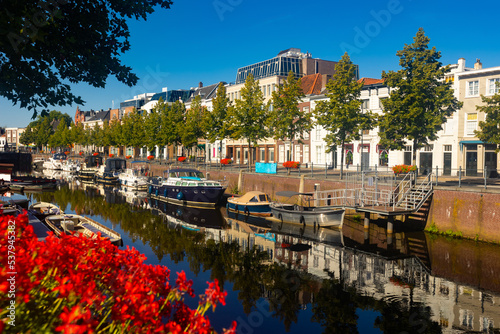 Picturesque view of houses, streets and river at Breda town at sunny day, Netherlands, province of North Brabant photo
