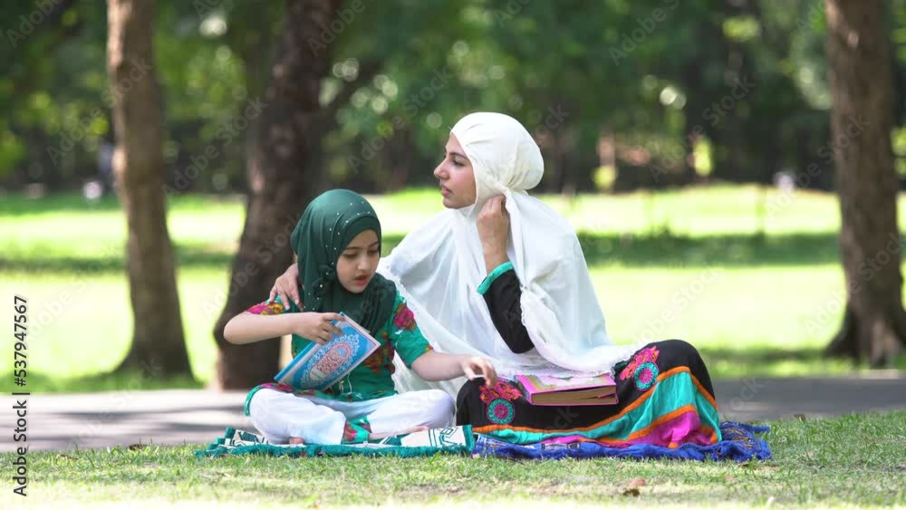 Muslim Mother Teaching Her Daughter To Pray Quran Bible Happy Mom With Hijab And Cute Daughter 