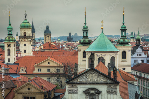 Above medieval Prague old town towers and domes at evening, Czech © Aide