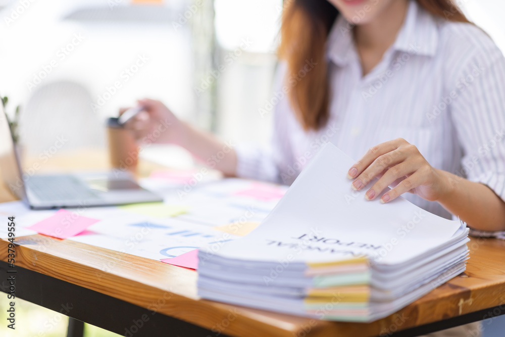 Close up of Business hands working in Stacks of paper files for searching information on work desk workplace office, Office employee working with documents achieves with clips at table in workplace.