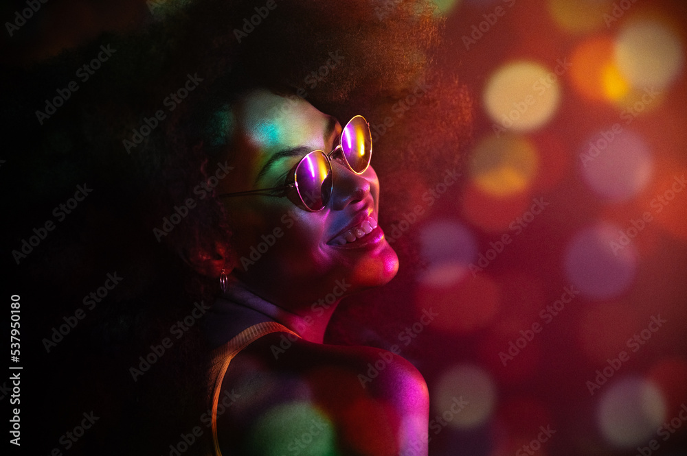 African American model under colorful studio illumination African American model under colorful studio illumination