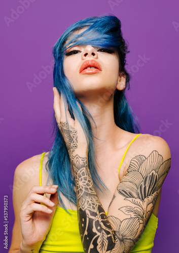 Stylish woman with closed eyes in studio photo