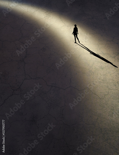 Photography A young girl’s body language says she is feeling vulnerable and insecure as she finds herself along in a shaft of light in this 3-d illustration