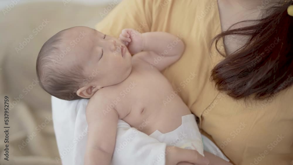 Selective focus Asian toddler newborn sleep in mother arm embracing gentle, comfortable, safe. Close up Mom hold infant with love, care, tenderly at home, new mom motherhood nurturing concept 25p4k
Selective focus Asian toddler newborn sleep in mother arm embracing gentle, comfortable, safe. Close up Mom hold infant with love, care, tenderly at home, new mom motherhood nurturing concept 25p4k