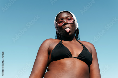 Black woman sticking her tongue out photo
