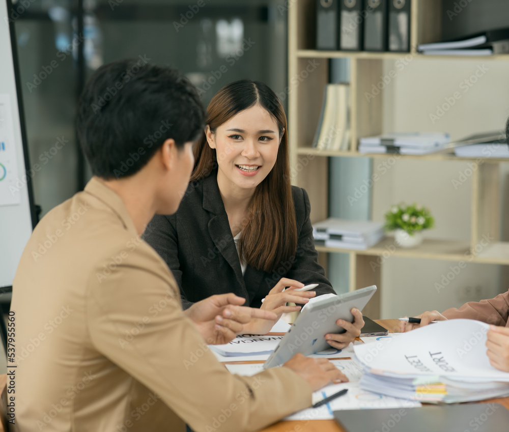 Asia business meeting consultations of business people in the company's meeting room. Asia business meeting consultations of business people in the company's meeting room.
