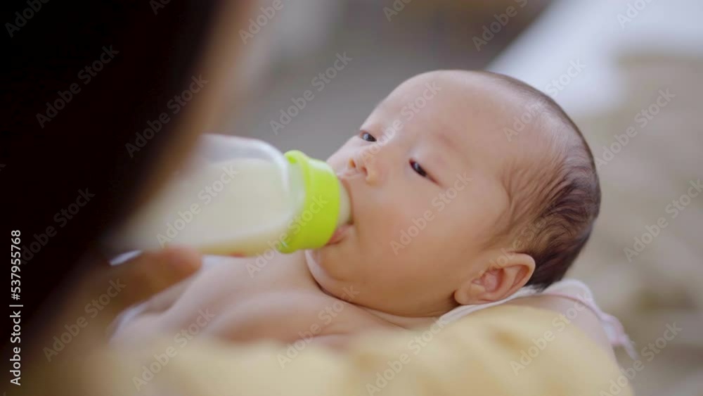 Selective focus newborn feeding and motherhood concept, Mother feed infant with breast milk in bottle at home, mom hold baby boy close to breast with love tender, toddler feeling safe and looking mom
Selective focus newborn feeding and motherhood concept, Mother feed infant with breast milk in bottle at home, mom hold baby boy close to breast with love tender, toddler feeling safe and looking mom