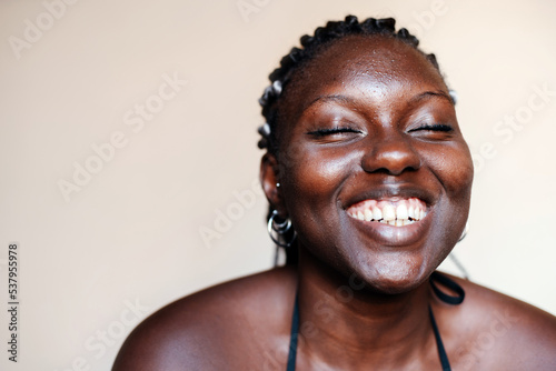 Close up portrait of smiling black woman photo