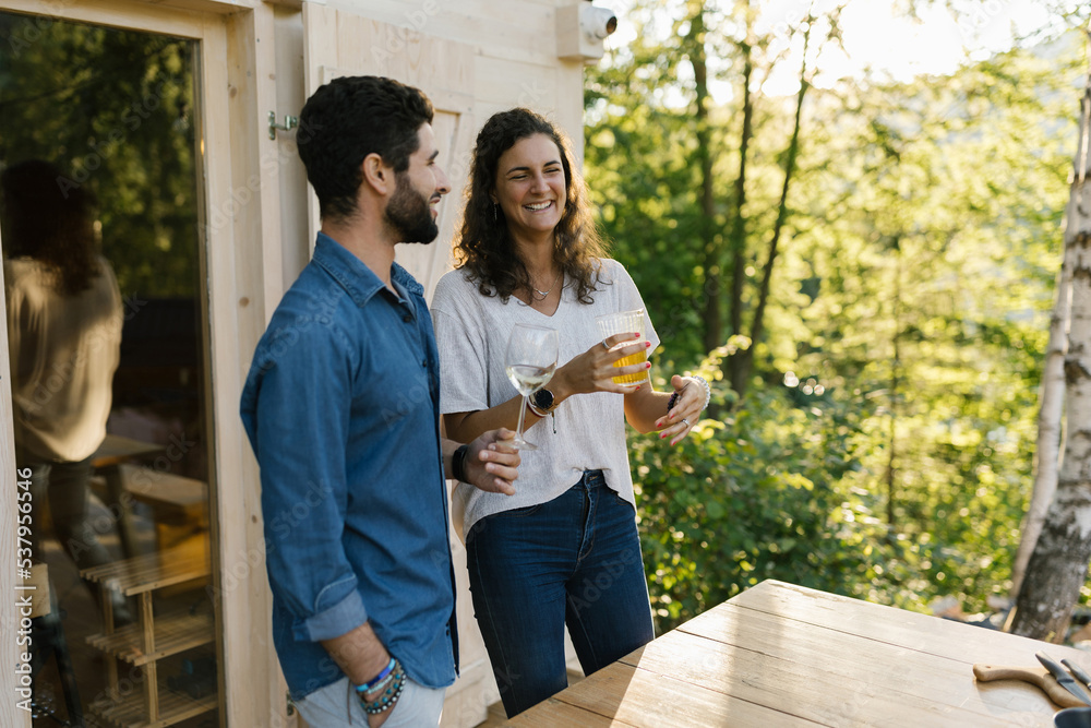 Caucasian Couple Talking Over Drinks Outdoors Caucasian Couple Talking Over Drinks Outdoors