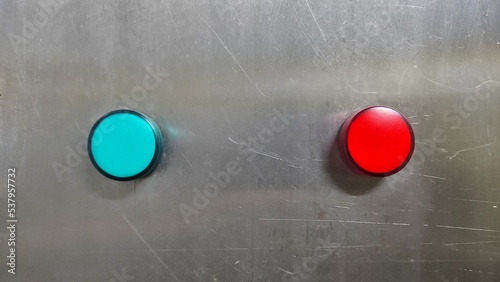 industrial background of red and green buttons panel with scratch on it of the industrial machine in factory