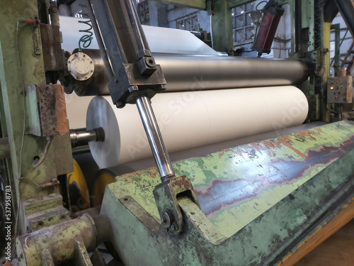 Kolkata, West Bengal, India - 16th May 2019 : White Paper Reels are being manufactured in a paper manufacturing plant. Indian paper industry is growing.