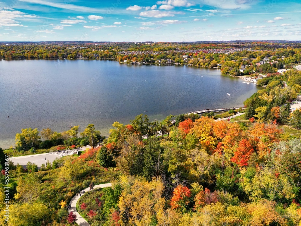 Aerial view of lake and forest in autumn season at Lake Wilcox. Wilcox is a kettle lake in the Oak Ridges neighbourhood of Richmond Hill, Ontario, Canada. Aerial view of lake and forest in autumn season at Lake Wilcox. Wilcox is a kettle lake in the Oak Ridges neighbourhood of Richmond Hill, Ontario, Canada.