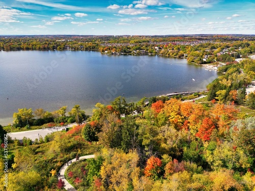 Aerial view of lake and forest in autumn season at Lake Wilcox. Wilcox is a kettle lake in the Oak Ridges neighbourhood of Richmond Hill, Ontario, Canada.