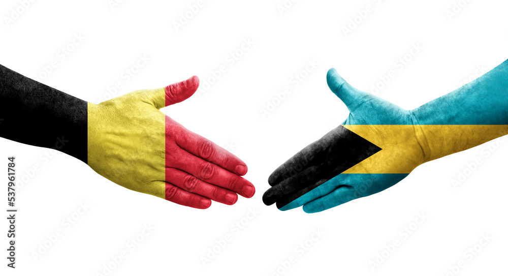 Handshake between Bahamas and Belgium flags painted on hands, isolated transparent image. Handshake between Bahamas and Belgium flags painted on hands, isolated transparent image.