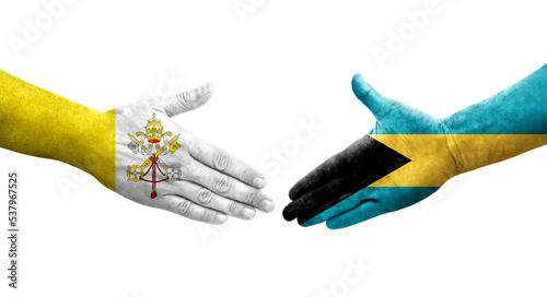 Handshake between Bahamas and Holy See flags painted on hands, isolated transparent image.