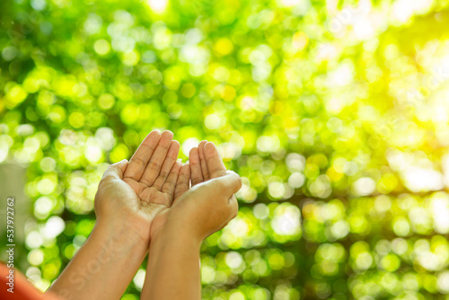 Technology, hand holding with environment Icons over the Network connection on green background.