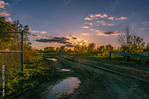 old railroad tracks, rail yard sunset 