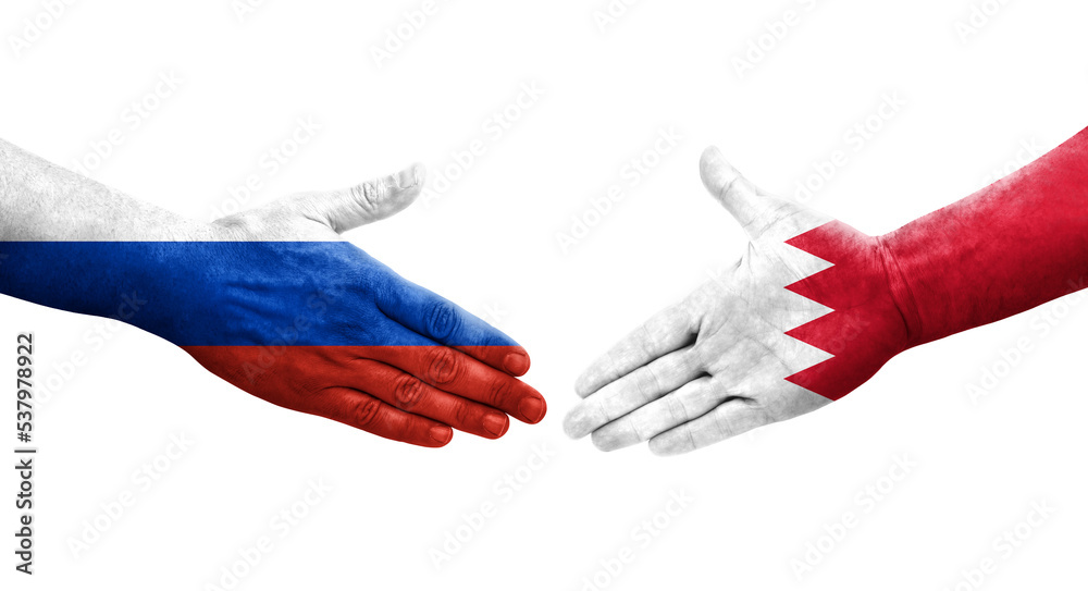 Handshake between Bahrain and Russia flags painted on hands, isolated transparent image. Handshake between Bahrain and Russia flags painted on hands, isolated transparent image.