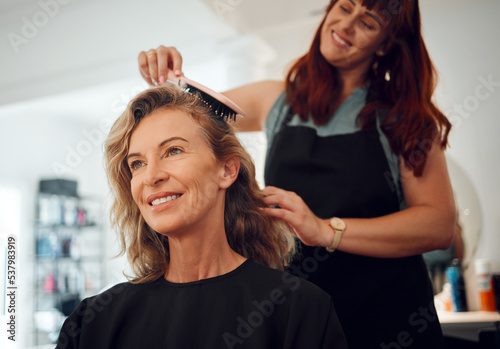 Hair care, brush and hairdresser with senior customer for hair maintenance, hair salon service or beauty studio spa treatment. Happy, smile and designer hairstyle for client with beautician stylist
