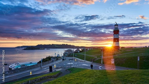 Plymouth Hoe with Smeaton's Tower lighthouse, sunset timelapse. City, Devon, England, UK photo