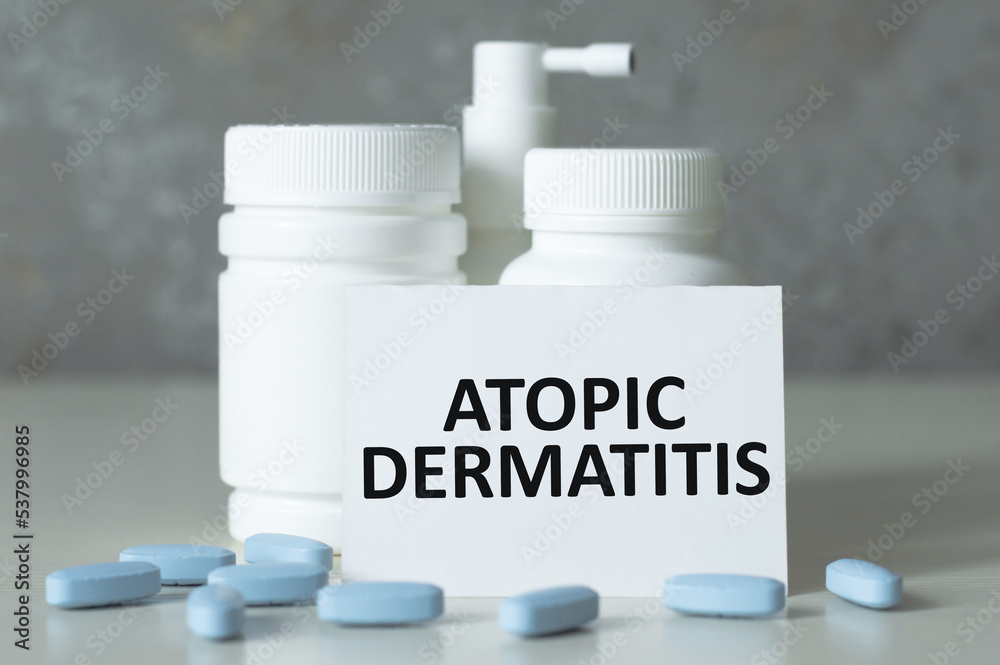 a white card with the text ATOPIC DERMATITIS. Medical concept a white card with the text ATOPIC DERMATITIS. Medical concept