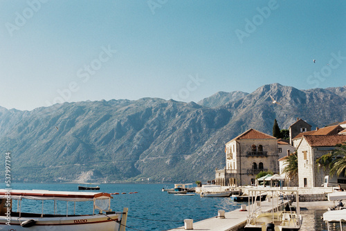 Pier with moored boats near the coast of Perast. Montenegro