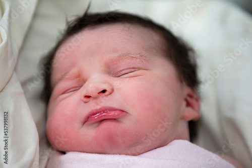 Close-up of the face of a newborn baby.