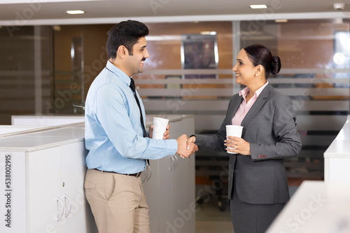 Photography Young couple discussing about business in the modern office