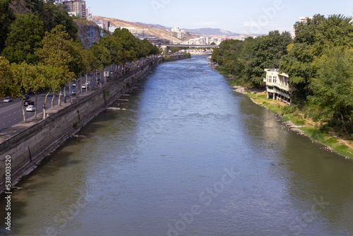 View of the Kura River from the bridge. Georgia. Tbilisi. Urban landscape.
