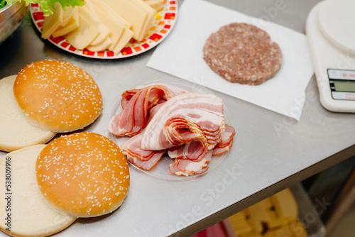 The process of making a burger. Ingredients for making a burger. Everything you need to make a burger is laid out on the table.