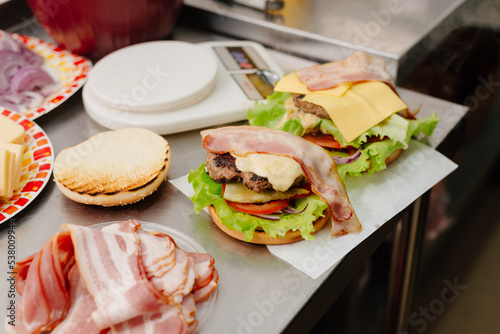 The process of making a burger. Ingredients for making a burger. Everything you need to make a burger is laid out on the table.