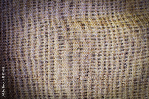 Linen natural background and texture. Jute hessian burlap natural burlap texture background in yellow gold brown color. Burlap texture background. Fabric texture closeup