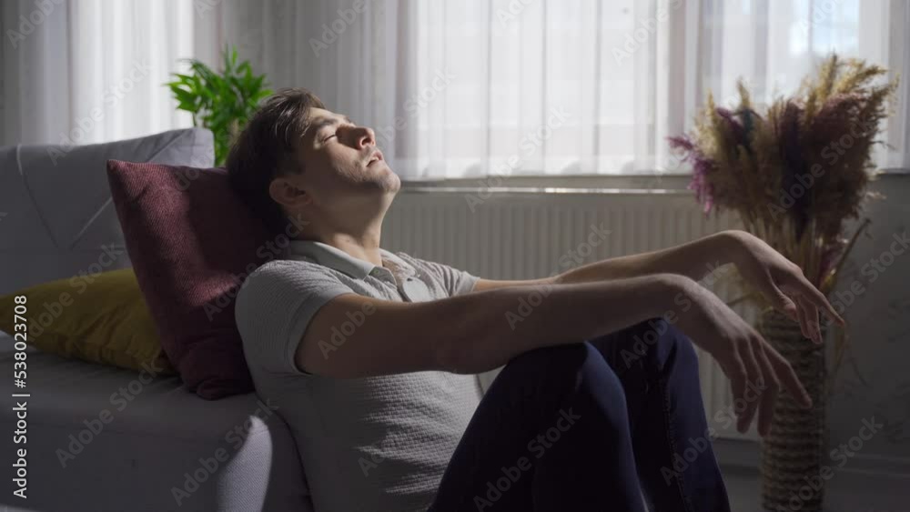 Close-up of depressed and frustrated man at home.
Stressed man at home tired and despondent.
