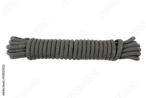 Coiled nylon rope isolated on white background. Striped nylon rope isolated. A coil of new black rope.